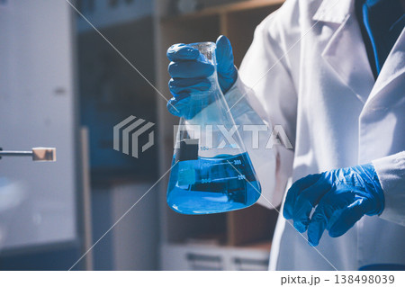 Science, laboratory and woman with pipette, test tube and biotech solution in research. Medical innovation, scientist or lab technician in study for healthcare, medicine and vaccine results feedback. Science, laboratory and woman with pipette, test tube and biotech solution in research. Medical innovation, scientist or lab technician in study for healthcare, medicine and vaccine results feedback. 138498039