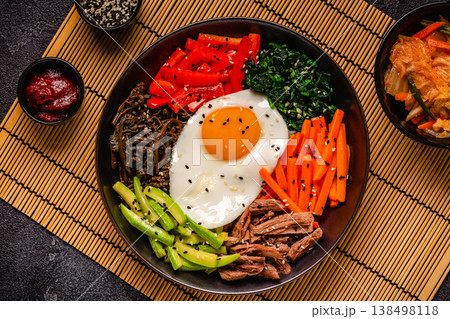 Traditional Korean dish Bibimbap: rice with vegetables beef and egg. Traditional Korean dish Bibimbap: rice with vegetables beef and egg. 138498118