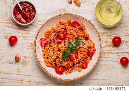 Homemade pasta with tomato sauce, top view. 138498172