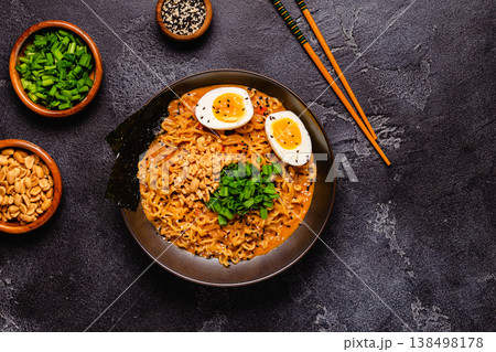Korean style instant noodle, Shin Ramyeon with peanut and egg. Korean style instant noodle, Shin Ramyeon with peanut and egg. 138498178