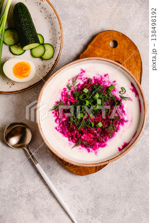 Cold summer soup of beets, kefir, cucumbers, eggs and dill. 138498192