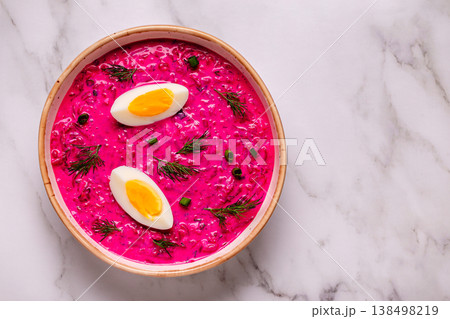 Cold summer soup of beets, yogurt, cucumbers, eggs and dill. 138498219
