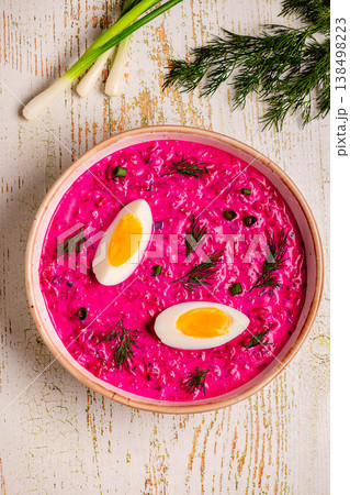 Cold summer soup of beets, yogurt, cucumbers, eggs and dill. 138498223