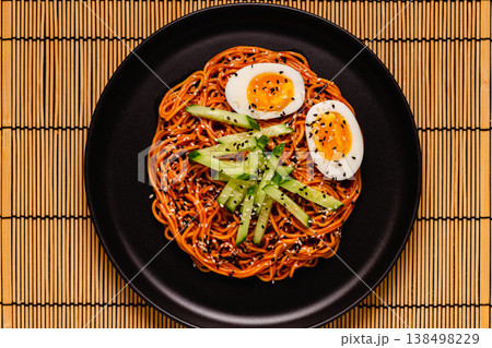 Korean traditional food, cucumber and boiled egg cold spicy noodles. 138498229