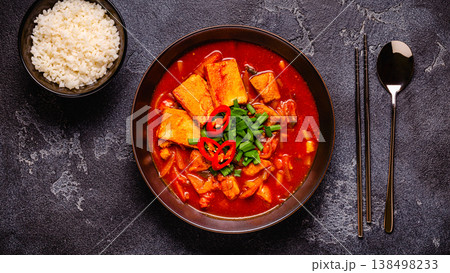 Korean traditional food, spicy kimchi soup (kimchi tige) with pork and tofu cheese. Korean traditional food, spicy kimchi soup (kimchi tige) with pork and tofu cheese. 138498233
