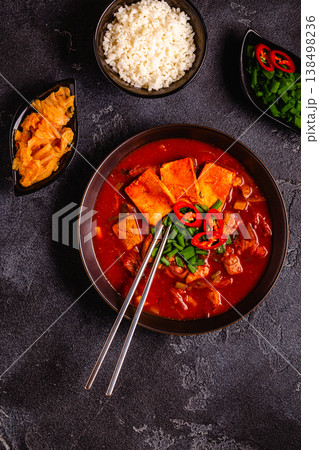 Korean traditional food, spicy kimchi soup (kimchi tige) with pork and tofu cheese. Korean traditional food, spicy kimchi soup (kimchi tige) with pork and tofu cheese. 138498236