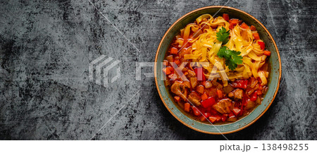 Lagman soup with lamb, homemade noodles and vegetables. 138498255