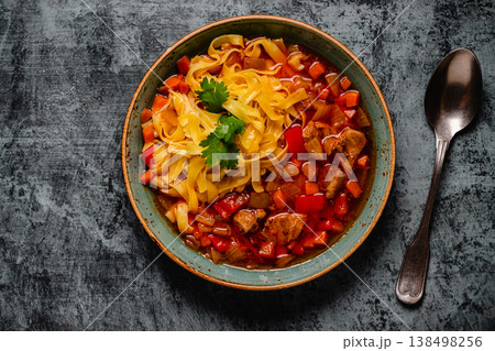 Lagman soup with lamb, homemade noodles and vegetables. Lagman soup with lamb, homemade noodles and vegetables. 138498256