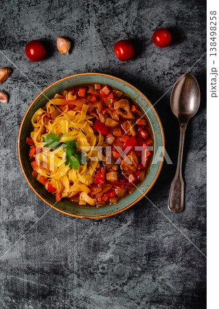 Lagman soup with lamb, homemade noodles and vegetables. 138498258