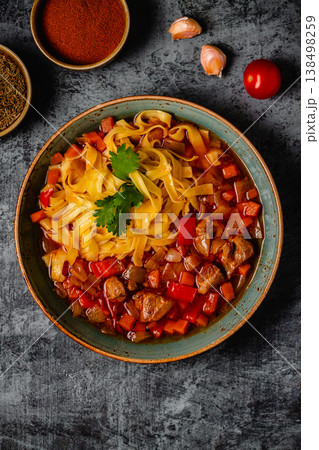 Lagman soup with lamb, homemade noodles and vegetables. Lagman soup with lamb, homemade noodles and vegetables. 138498259