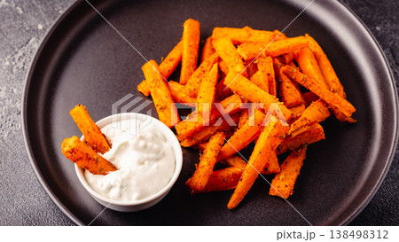 Sweet potato fries with blue cheese sauce. 138498312