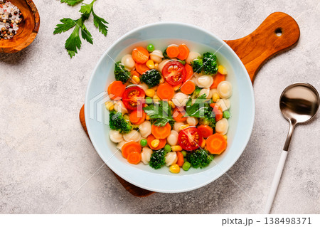 Soup with mini dumplings and vegetables. Soup with mini dumplings and vegetables. 138498371