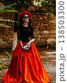 Day of the Dead. Portrait of a woman with a wreath and wearing a full-length skull costume. Artistic composition. 138503300