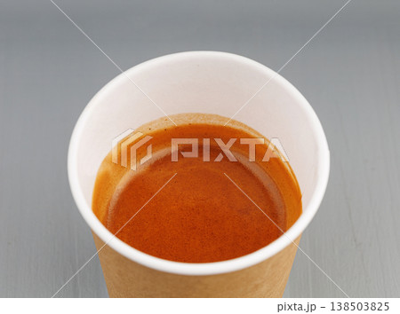 top view cardboard cup with coffee, espresso, americano on gray wooden background top view cardboard cup with coffee, espresso, americano on gray wooden background 138503825