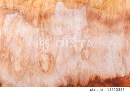 abstract pattern on silk fabric texture in yellow and brown tones abstract pattern on silk fabric texture in yellow and brown tones 138503854