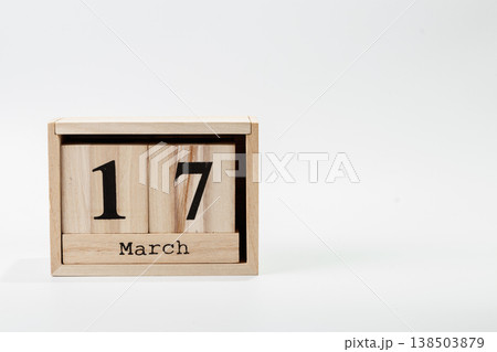 Wooden calendar March 17 on a white background Wooden calendar March 17 on a white background 138503879