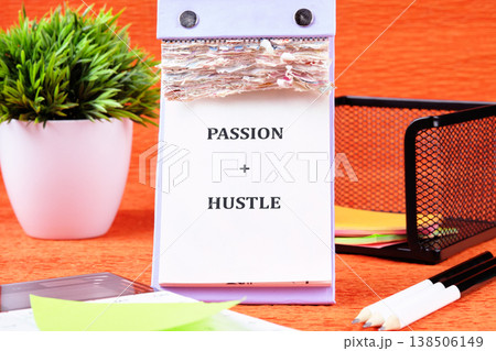 Desk calendars passion hustle message, green plant, neat workspace igniting ambition Desk calendars passion hustle message, green plant, neat workspace igniting ambition 138506149