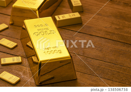 Fine Gold Bars and Bullion Arranged on Wooden Table - Precious Metal Investment and Wealth Fine Gold Bars and Bullion Arranged on Wooden Table - Precious Metal Investment and Wealth 138506738