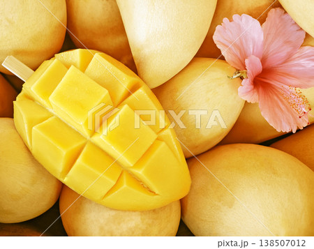 Fresh ripe yellow mango slices beautifully arranged on a dining table, appetizing tropical fruit, healthy food concept. 138507012
