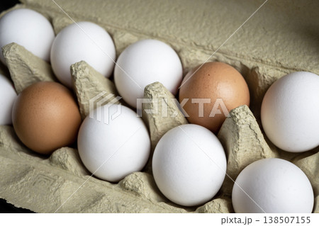 Fresh eggs in the kitchen. Nature background. Chicken egg in carton box for cooking healthy food. Bio organic eggs on the farm. Food concept. 138507155
