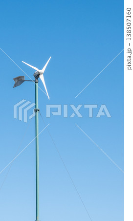Landscape during sunset with road, fields and wind turbines. Windmills for energy production. Green energy in Europe. Landscape during sunset with road, fields and wind turbines. Windmills for energy production. Green energy in Europe. 138507160