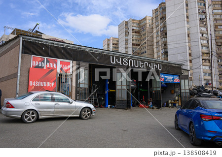 Car service center with silver and blue vehicles parked Car service center with silver and blue vehicles parked 138508419