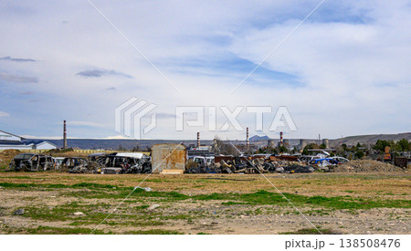 Abandoned scrapyard with weathered metal stacks Abandoned scrapyard with weathered metal stacks 138508476