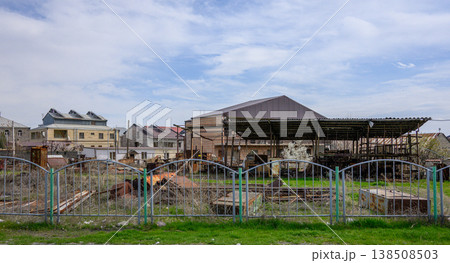 Decaying rural property with collapsed roof and overgrown yard 138508503
