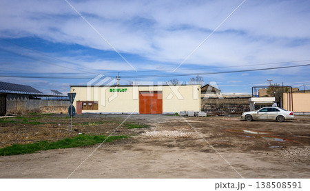 Warehouse-like structure with faded signage 138508591