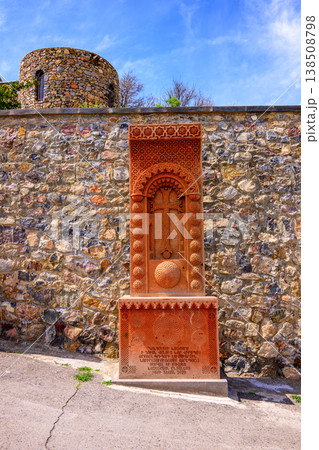 Old stone monument near fortress wall under clear sky Old stone monument near fortress wall under clear sky 138508798