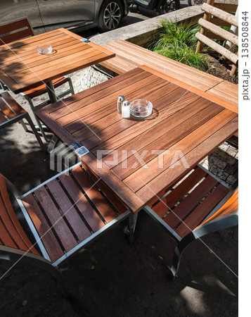Empty outdoor cafe tables with qr code waiting for customers in prague Empty outdoor cafe tables with qr code waiting for customers in prague 138508844