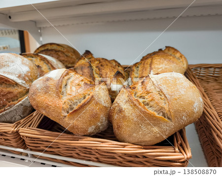 Freshly baked sourdough bread displayed in wicker basket in prague bakery Freshly baked sourdough bread displayed in wicker basket in prague bakery 138508870