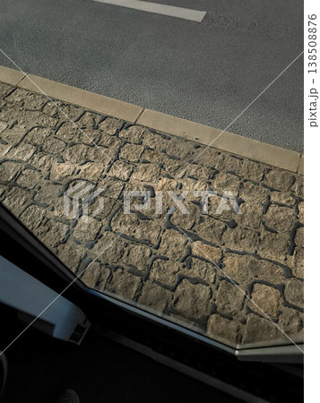 Cobblestone sidewalk seen from bus window in prague 138508876