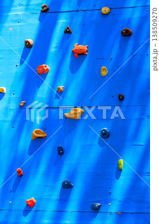 Background of the climbing wall with toe and hand hold studs 138509270