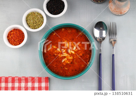 Traditional Turkish Orzo Soup with Tomato Paste and Dried Mint, Warm Homemade Vegetable Broth Base Traditional Turkish Orzo Soup with Tomato Paste and Dried Mint, Warm Homemade Vegetable Broth Base 138510631