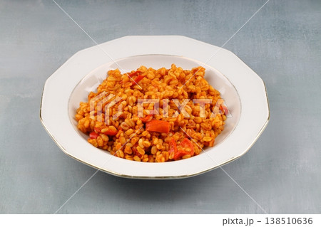 Traditional turkish bulgur pilaf with tomato sause in plate (Turkish name; meyhane pilavi) 138510636
