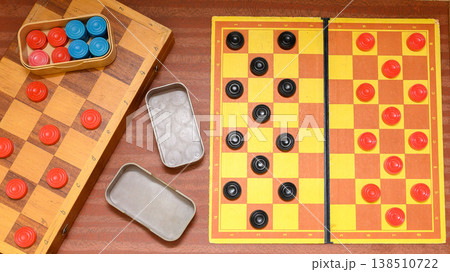 top view of checkers game fields with arranged pieces and boxes 138510722