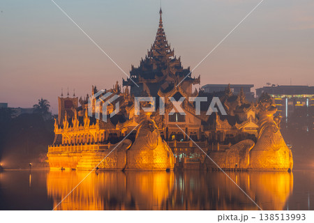 Beautiful Karaweik Palace in Yangon township of Myanmar at dawn. Karaweik Palace is designed as a concrete replica of a traditional golden royal barge. Opened in 1974. 138513993