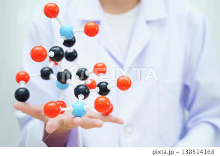Scientist holding molecular model for chemical technology. Scientist holding molecular model for chemical technology. 138514168