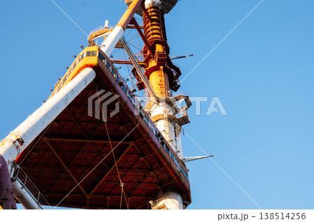 Low angle view of the weathered red and white steel support struts of Tbilisi TV tower in Mtatsminda Park Low angle view of the weathered red and white steel support struts of Tbilisi TV tower in Mtatsminda Park 138514256