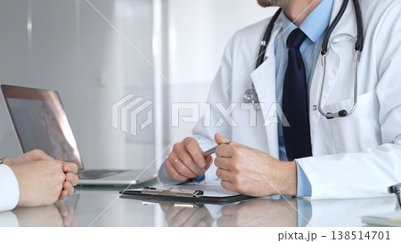 Doctor consulting patient about healthcare, discussing medical examination results on laptop in clinic office. Medicine, healthcare and science concept Doctor consulting patient about healthcare, discussing medical examination results on laptop in clinic office. Medicine, healthcare and science concept 138514701