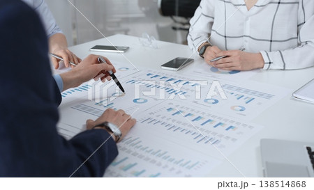 Business professionals analyzing financial data reports, collaborating during a corporate meeting, discussing market trends, and developing new strategies for growth and investment Business professionals analyzing financial data reports, collaborating during a corporate meeting, discussing market trends, and developing new strategies for growth and investment 138514868