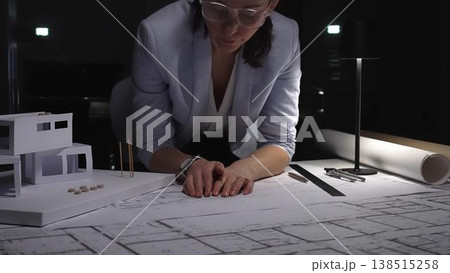 Female architect thinking about a modern house architecture project with blueprint and model on desk. Business and architect people concept Female architect thinking about a modern house architecture project with blueprint and model on desk. Business and architect people concept 138515258