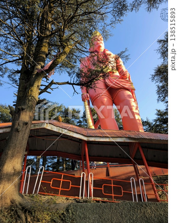 Rear-side view of the Hanuman statue at Jakhu Temple with surrounding forest and temple structure, capturing devotion, elevation, and sacred mountain surroundings. Rear-side view of the Hanuman statue at Jakhu Temple with surrounding forest and temple structure, capturing devotion, elevation, and sacred mountain surroundings. 138515893
