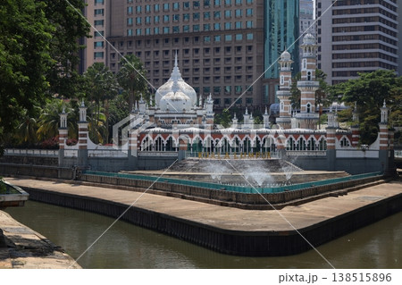 Mosque beside a water feature in Kuala Lumpur, Malaysia, blending Islamic architecture with modern urban surroundings. Mosque beside a water feature in Kuala Lumpur, Malaysia, blending Islamic architecture with modern urban surroundings. 138515896
