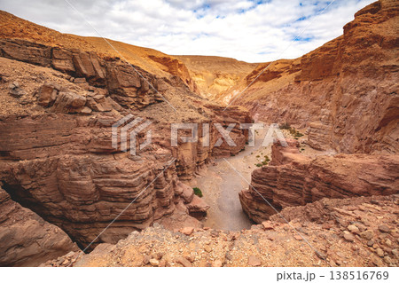 Dry riverbed, wilderness. Desert nature landscape. Sandstone texture. Red Canyon in the Negev Desert near Eilat in Israel 138516769