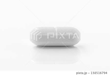 White pill on white background. 138516794