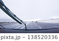 The open highway invites a peaceful drive, with snow-clad pines lining I-25 as the journey continues from Denver towards Colorado Springs on a snowy day. 138520336