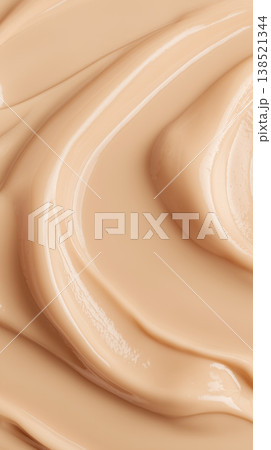 Creamy cosmetic smear in macro style on neutral cappuccino backdrop showing skincare texture with smooth detail concept Creamy cosmetic smear in macro style on neutral cappuccino backdrop showing skincare texture with smooth detail concept 138521344