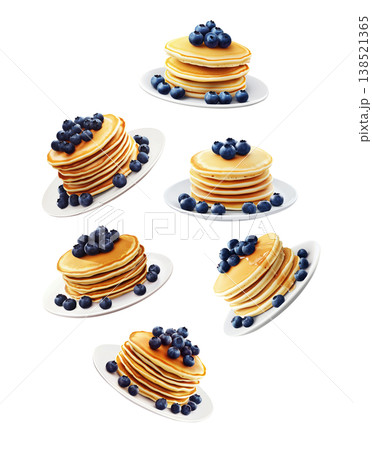 Multiple stacks of golden pancakes topped with fresh blueberries on plates, isolated on white background, breakfast food pattern Multiple stacks of golden pancakes topped with fresh blueberries on plates, isolated on white background, breakfast food pattern 138521365